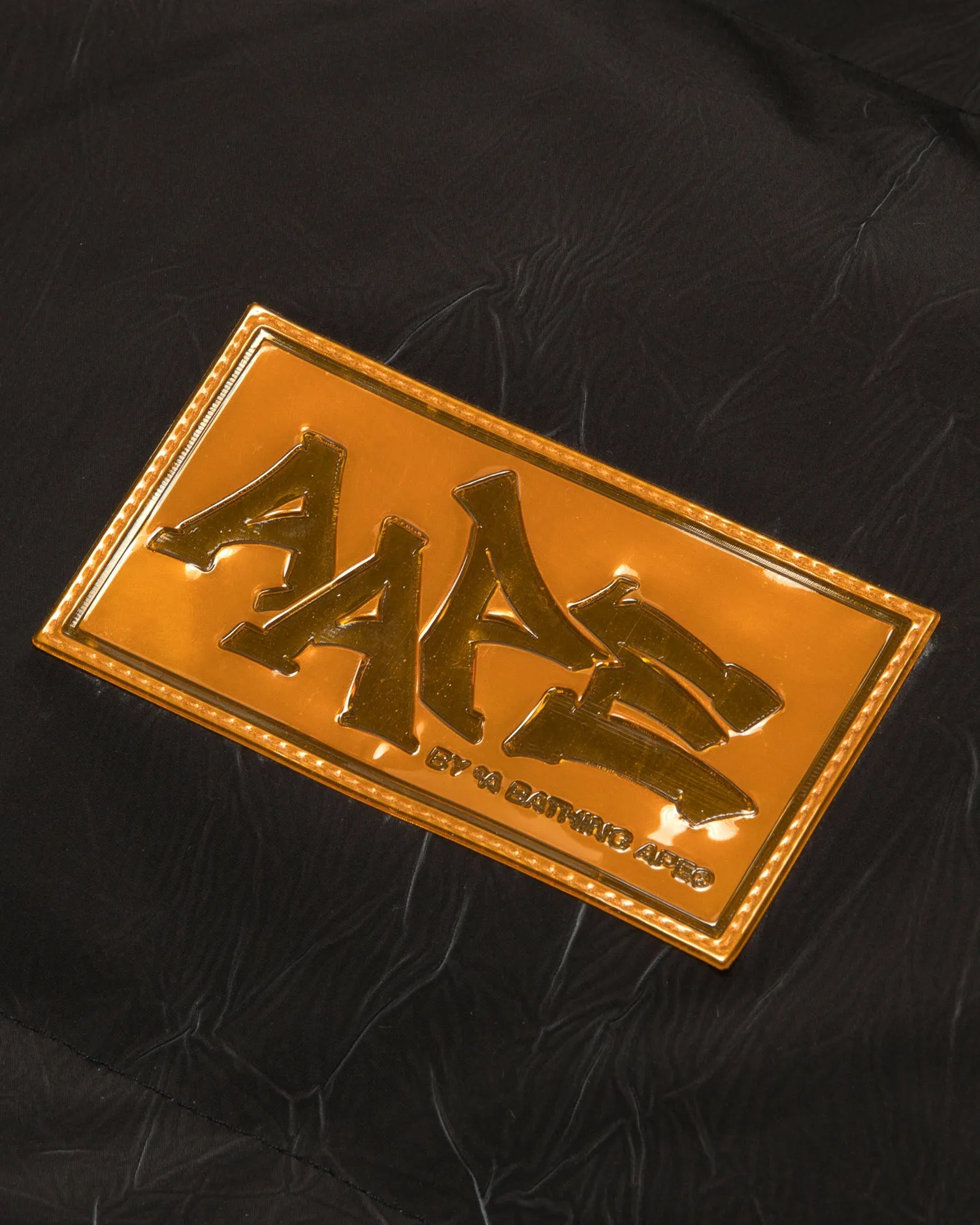 Moonface logo camo hooded puffer jacket